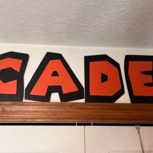 Custom red and black layered name letters displayed on a wall